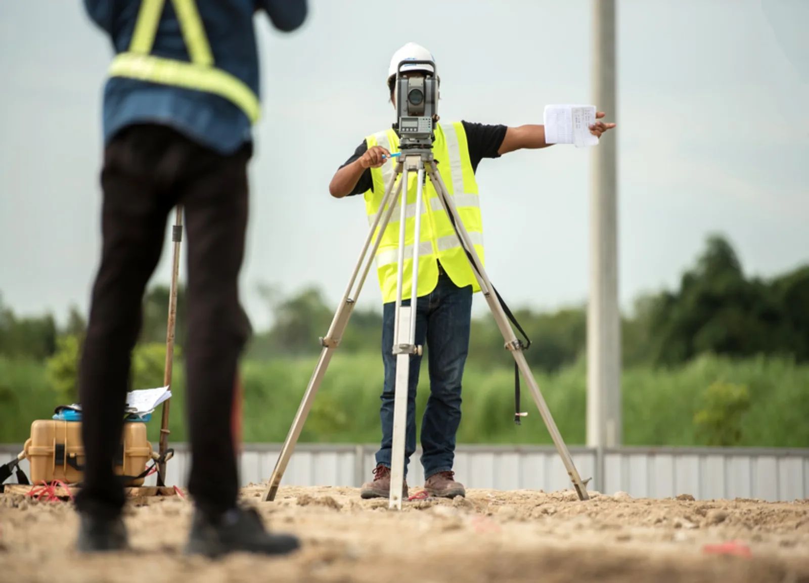 Survey crew performing staking and control on a construction site