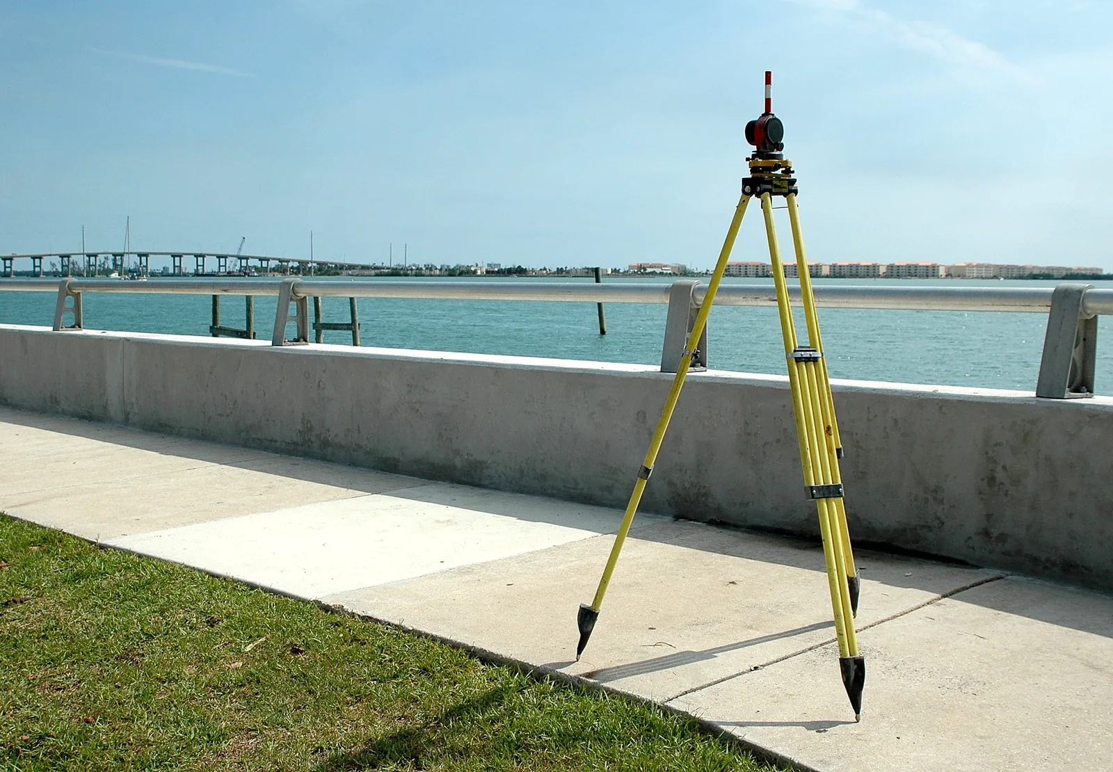Survey equipment supporting flood certifications and elevation documentation near the water