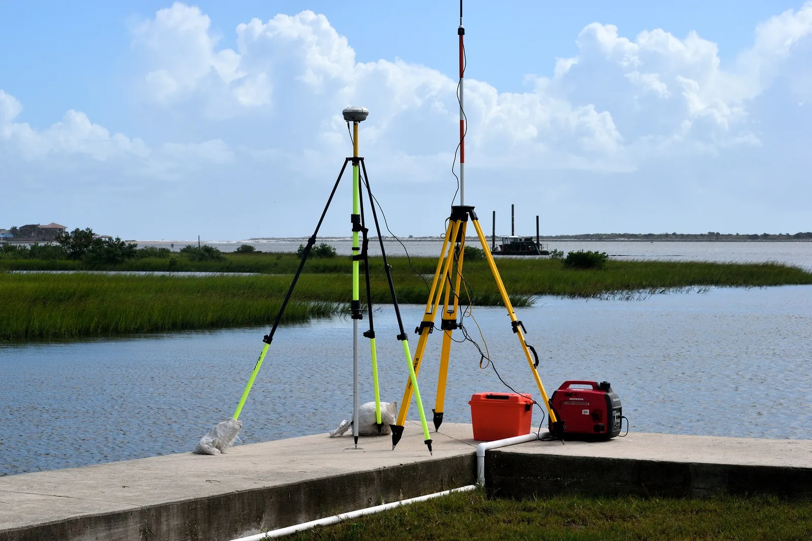 Floodplain survey equipment set up near coastal water