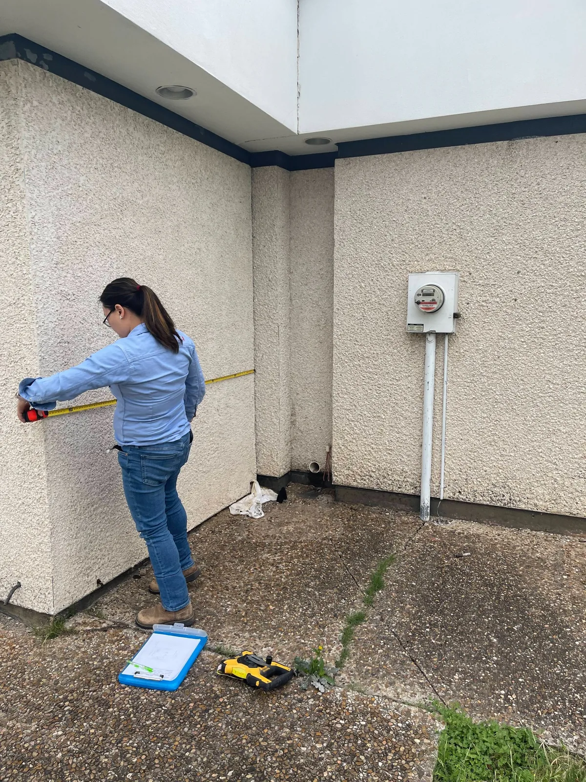Surveyor reviewing a residential property for a title or boundary survey